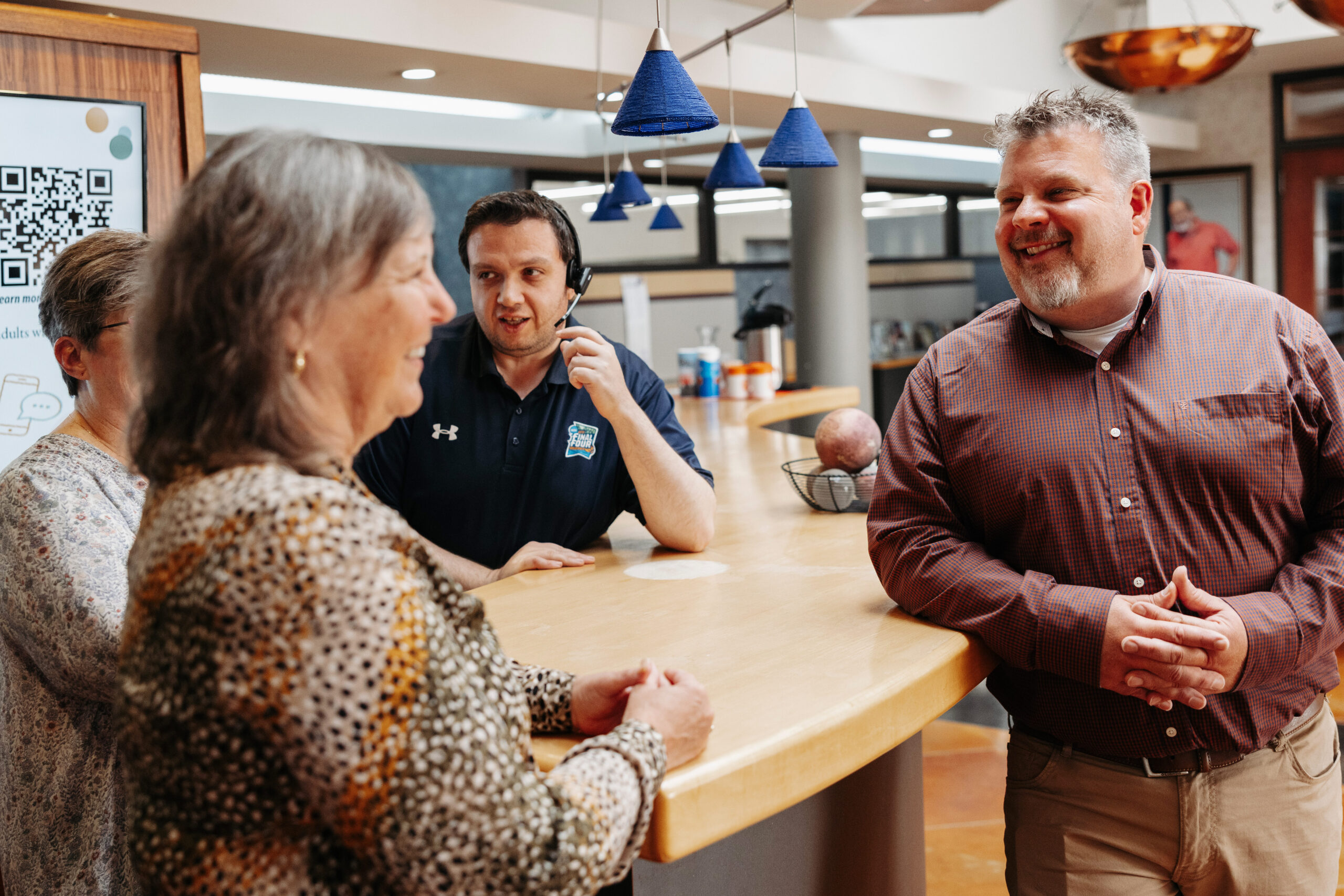 Point North Networks team members speaking with their nonprofit partners 